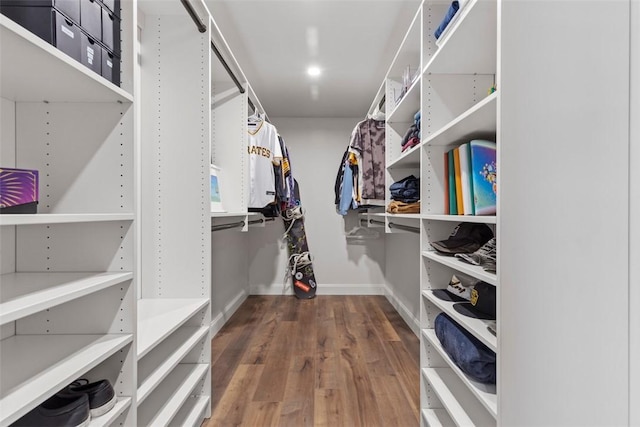 spacious closet with wood finished floors