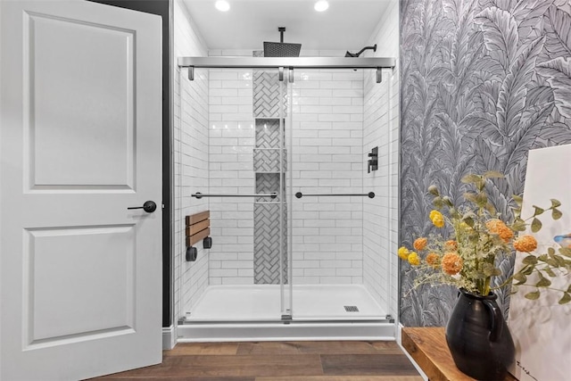 bathroom featuring a stall shower, wood finished floors, and recessed lighting