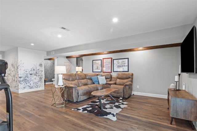 living area featuring baseboards, wood finished floors, and recessed lighting