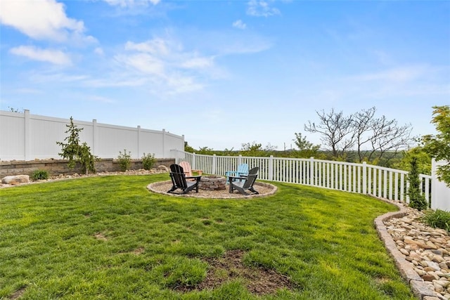 view of yard with an outdoor fire pit