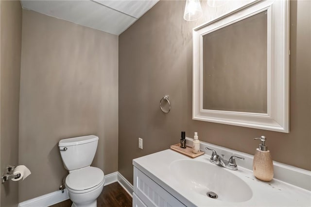 3613 Falmouth Dr, South Park, PA 15129 - bathroom with toilet, vanity, baseboards, and wood finished floors