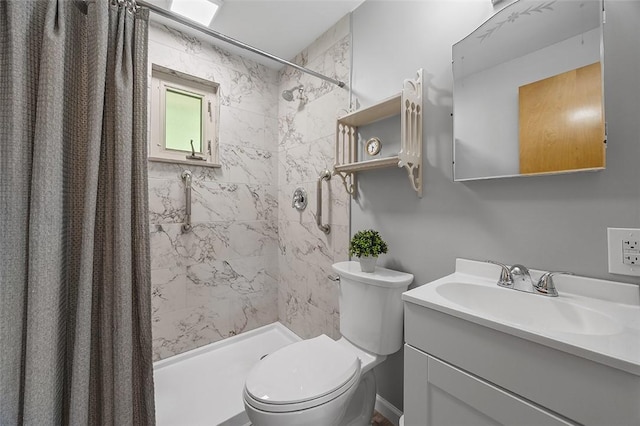 full bath featuring toilet, a shower stall, and vanity