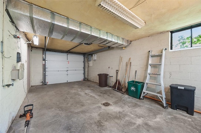 garage with concrete block wall