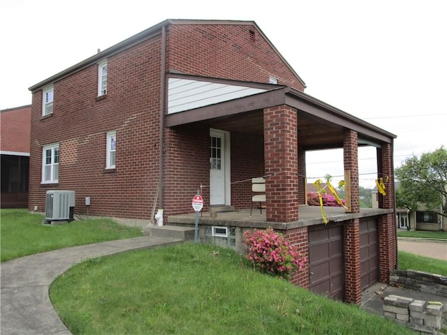 view of property exterior featuring central AC unit, brick siding, and covered porch