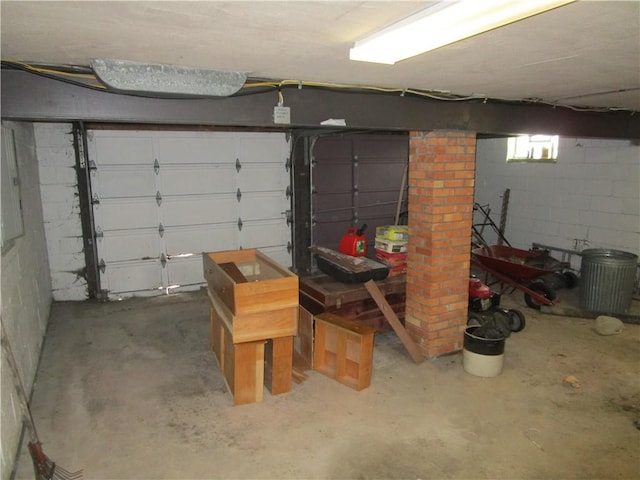 garage with concrete block wall