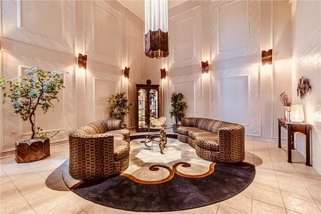 5600 Munhall Rd Unit 403, Squirrel Hill, PA 15217 - community lobby featuring a decorative wall and a towering ceiling