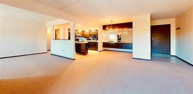 5600 Munhall Rd Unit 403, Squirrel Hill, PA 15217 - unfurnished living room featuring light colored carpet and baseboards