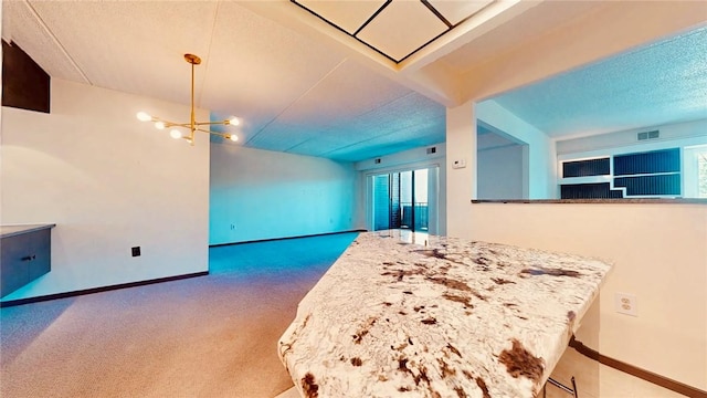 5600 Munhall Rd Unit 403, Squirrel Hill, PA 15217 - kitchen featuring carpet flooring, a chandelier, baseboards, open floor plan, and a textured ceiling