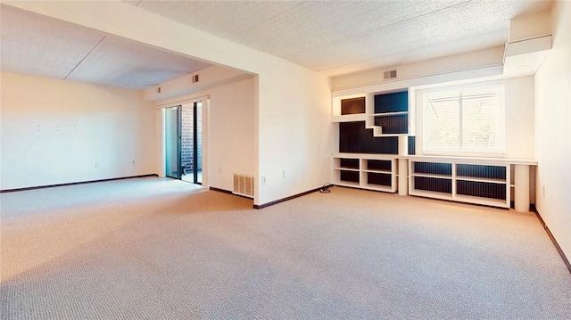 5600 Munhall Rd Unit 403, Squirrel Hill, PA 15217 - spare room with carpet, baseboards, and a textured ceiling