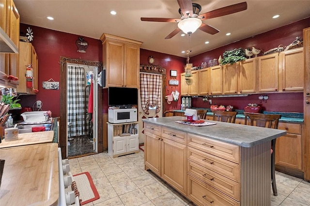 1320 3rd St, Jefferson Hills, PA 15025 - kitchen with ceiling fan, white microwave, recessed lighting, a kitchen island, and range with electric cooktop