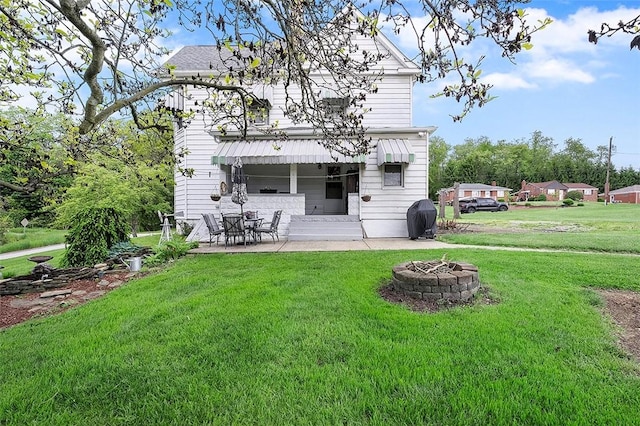 1320 3rd St, Jefferson Hills, PA 15025 - rear view of house featuring a lawn, a fire pit, a patio area, and entry steps