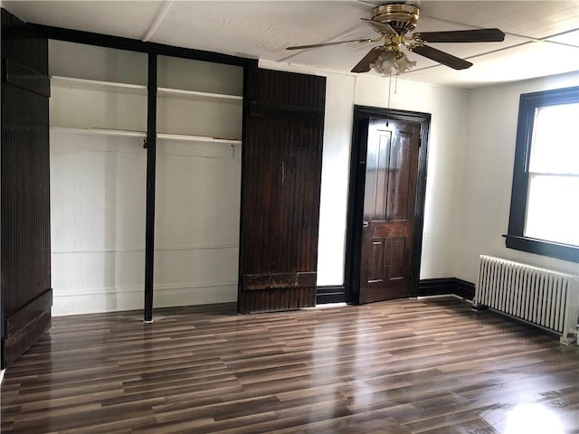 835 6th Ave, Brackenridge, PA 15014 - unfurnished bedroom featuring radiator, wood finished floors, baseboards, ceiling fan, and a closet