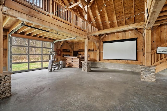 garage featuring wood walls