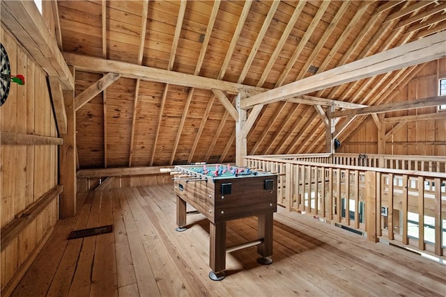 playroom featuring vaulted ceiling, hardwood / wood-style flooring, wooden walls, and wooden ceiling