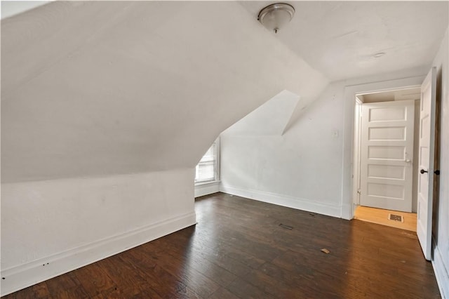 1608 Union Ave, Mckeesport, PA 15132 - additional living space featuring lofted ceiling, baseboards, and dark wood-type flooring