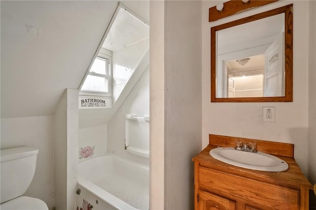 1608 Union Ave, Mckeesport, PA 15132 - full bathroom with toilet, vaulted ceiling, vanity, and a bathtub
