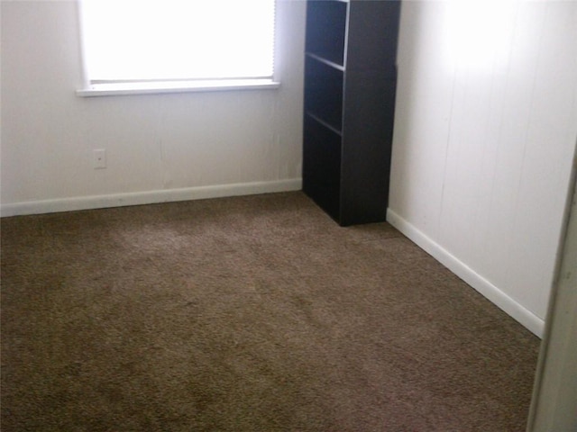 unfurnished bedroom with light carpet and baseboards