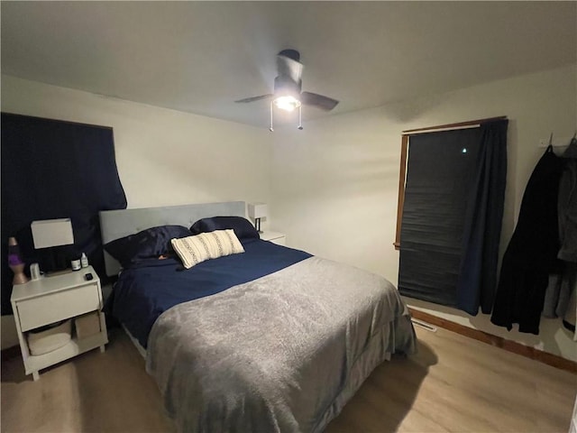 bedroom with wood finished floors and ceiling fan