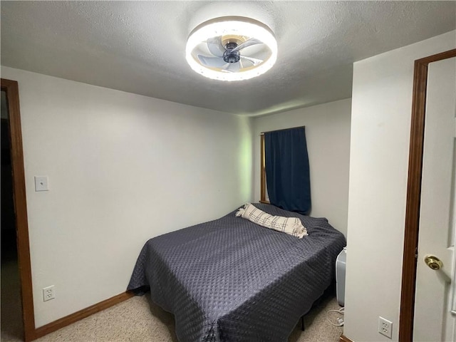 carpeted bedroom with baseboards