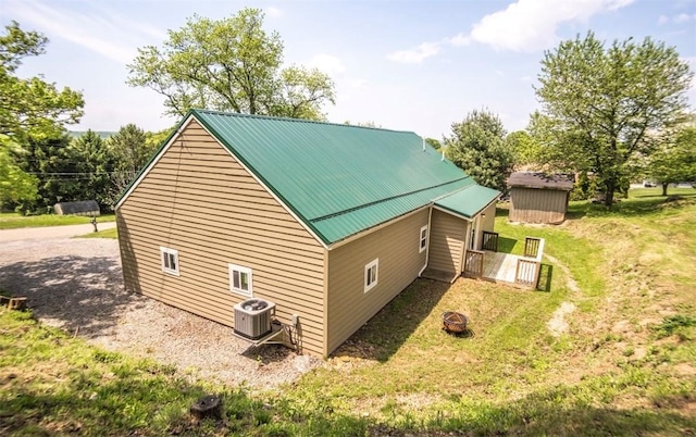 1435 Orchard St, New Sewickley Twp, PA 15042 - view of home's exterior with central AC unit, metal roof, and a lawn