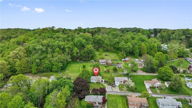 aerial overview of property's location with a forest