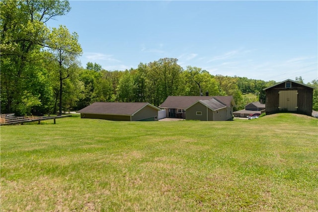 1207 Luciusboro Rd, Blairsville Area, PA 15717 - view of green lawn with a storage shed, an outbuilding, and a forest view