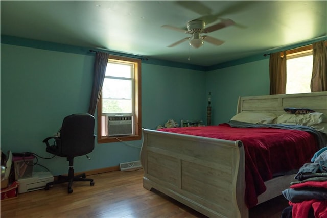 1207 Luciusboro Rd, Blairsville Area, PA 15717 - bedroom with wood finished floors, cooling unit, a ceiling fan, and baseboards