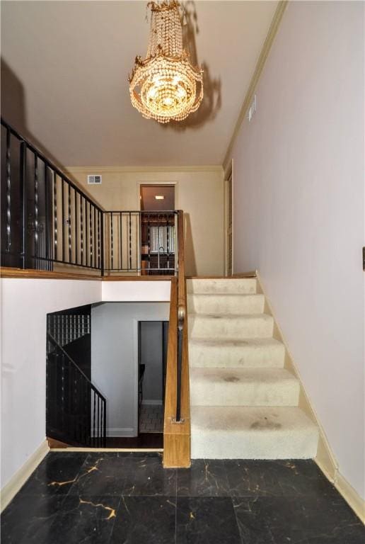 stairway featuring marble tiled floors, baseboards, and a chandelier