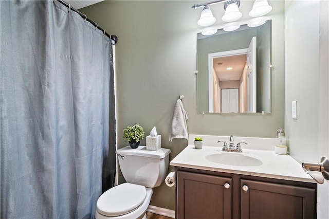 bathroom featuring vanity and toilet