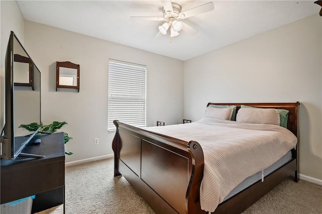 bedroom featuring carpet floors, baseboards, and a ceiling fan