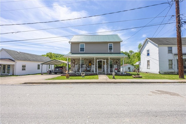 135 Oak Forest Rd, New Freeport, PA 15316 - view of front facade with a porch, a detached carport, metal roof, concrete driveway, and a front yard