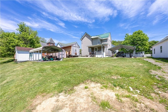 135 Oak Forest Rd, New Freeport, PA 15316 - rear view of property featuring a detached carport and a lawn