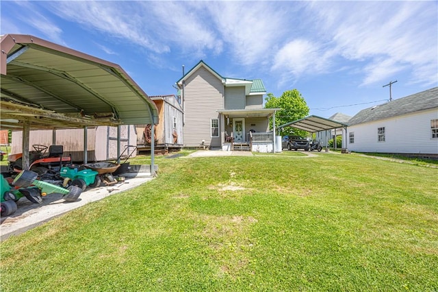 135 Oak Forest Rd, New Freeport, PA 15316 - rear view of property with a lawn, a carport, and covered porch