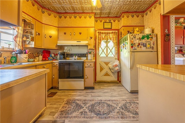 135 Oak Forest Rd, New Freeport, PA 15316 - kitchen with freestanding refrigerator, electric range oven, an ornate ceiling, light wood finished floors, and light countertops