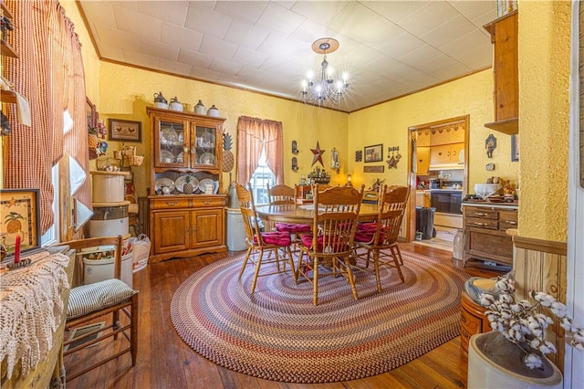 135 Oak Forest Rd, New Freeport, PA 15316 - dining room with hardwood / wood-style flooring, a textured wall, and a chandelier