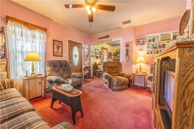 135 Oak Forest Rd, New Freeport, PA 15316 - carpeted living room featuring a ceiling fan, a glass covered fireplace, ornamental molding, and a textured wall