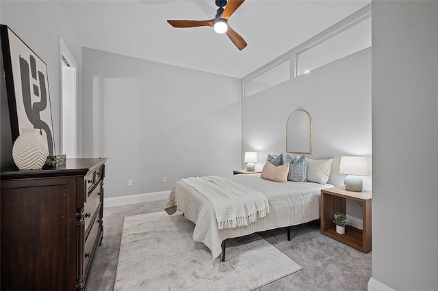 carpeted bedroom with baseboards and ceiling fan