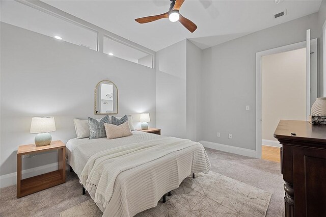 bedroom featuring light colored carpet, baseboards, ceiling fan, and recessed lighting