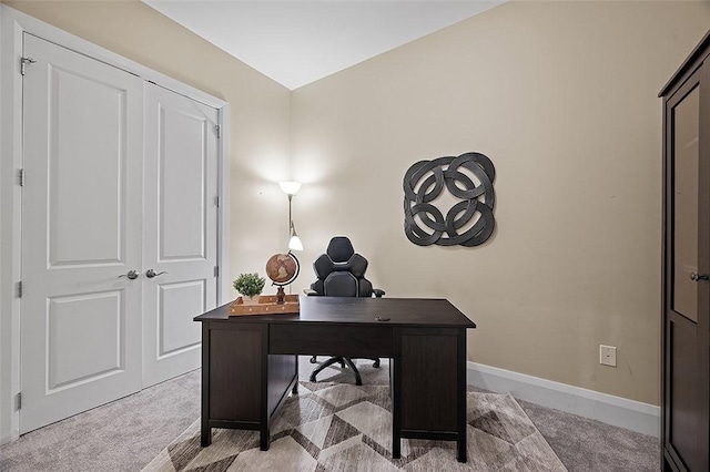 office space featuring carpet flooring and baseboards