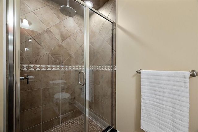 bathroom featuring a shower stall