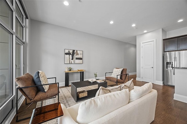 living room with recessed lighting, baseboards, and dark wood-style flooring