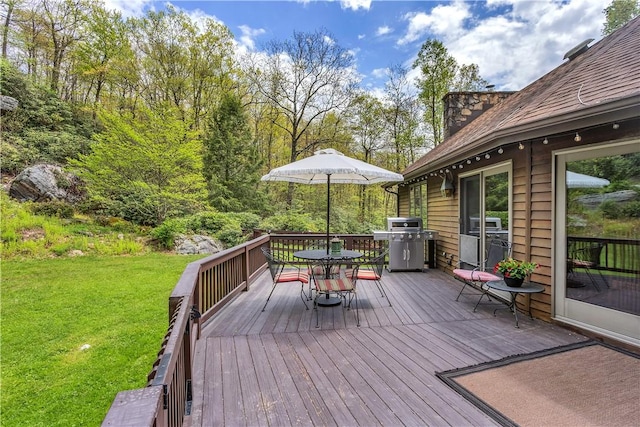2847 National Pike, Wharton Twp, PA 15421 - wooden terrace with outdoor dining area, a yard, and a grill