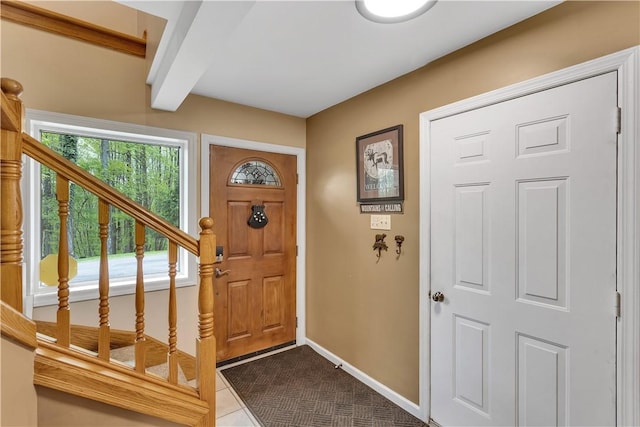 2847 National Pike, Wharton Twp, PA 15421 - foyer entrance with stairs, baseboards, dark tile patterned floors, and beam ceiling