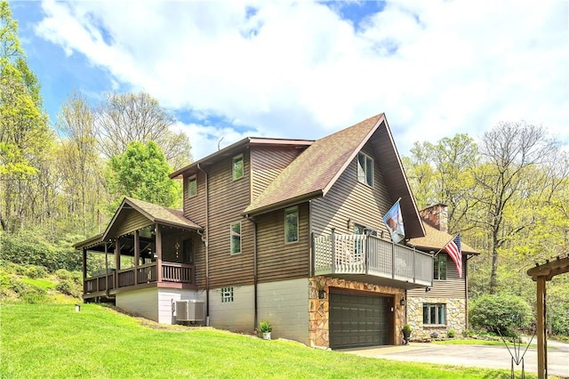 2847 National Pike, Wharton Twp, PA 15421 - view of side of property with central AC, a balcony, a yard, and a garage