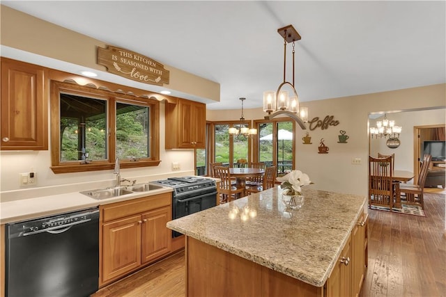 2847 National Pike, Wharton Twp, PA 15421 - kitchen featuring black appliances, a sink, a chandelier, a kitchen island, and light wood finished floors