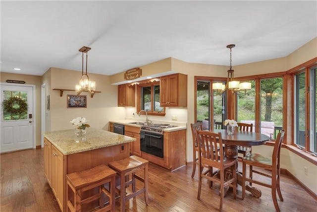 2847 National Pike, Wharton Twp, PA 15421 - kitchen with a chandelier, hardwood / wood-style floors, brown cabinets, plenty of natural light, and recessed lighting