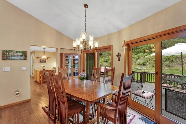 2847 National Pike, Wharton Twp, PA 15421 - dining area featuring a chandelier, light wood-style floors, baseboards, and high vaulted ceiling