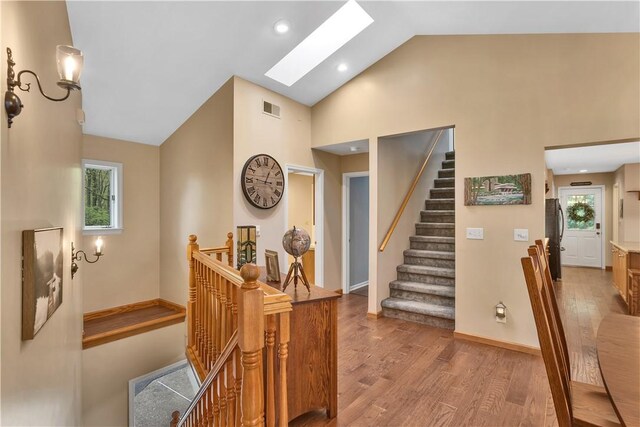 2847 National Pike, Wharton Twp, PA 15421 - corridor featuring wood finished floors, healthy amount of natural light, a skylight, high vaulted ceiling, and recessed lighting