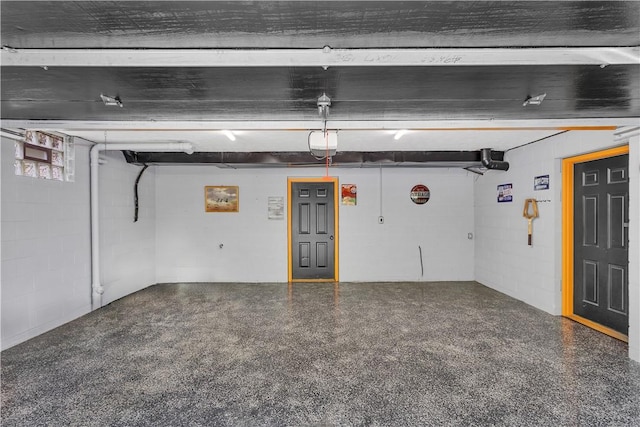 2847 National Pike, Wharton Twp, PA 15421 - garage featuring a garage door opener and concrete block wall