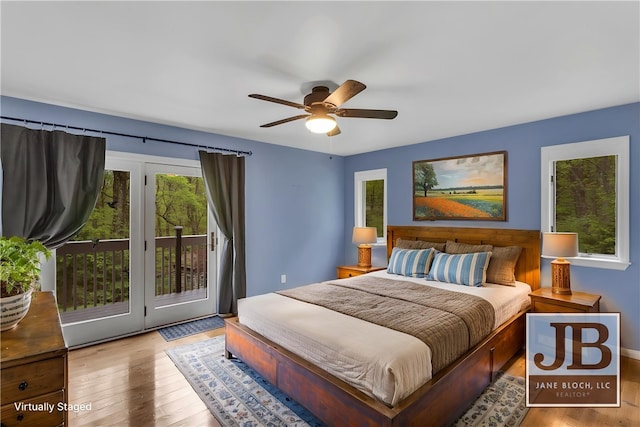 2847 National Pike, Wharton Twp, PA 15421 - bedroom with access to exterior, multiple windows, wood finished floors, and a ceiling fan